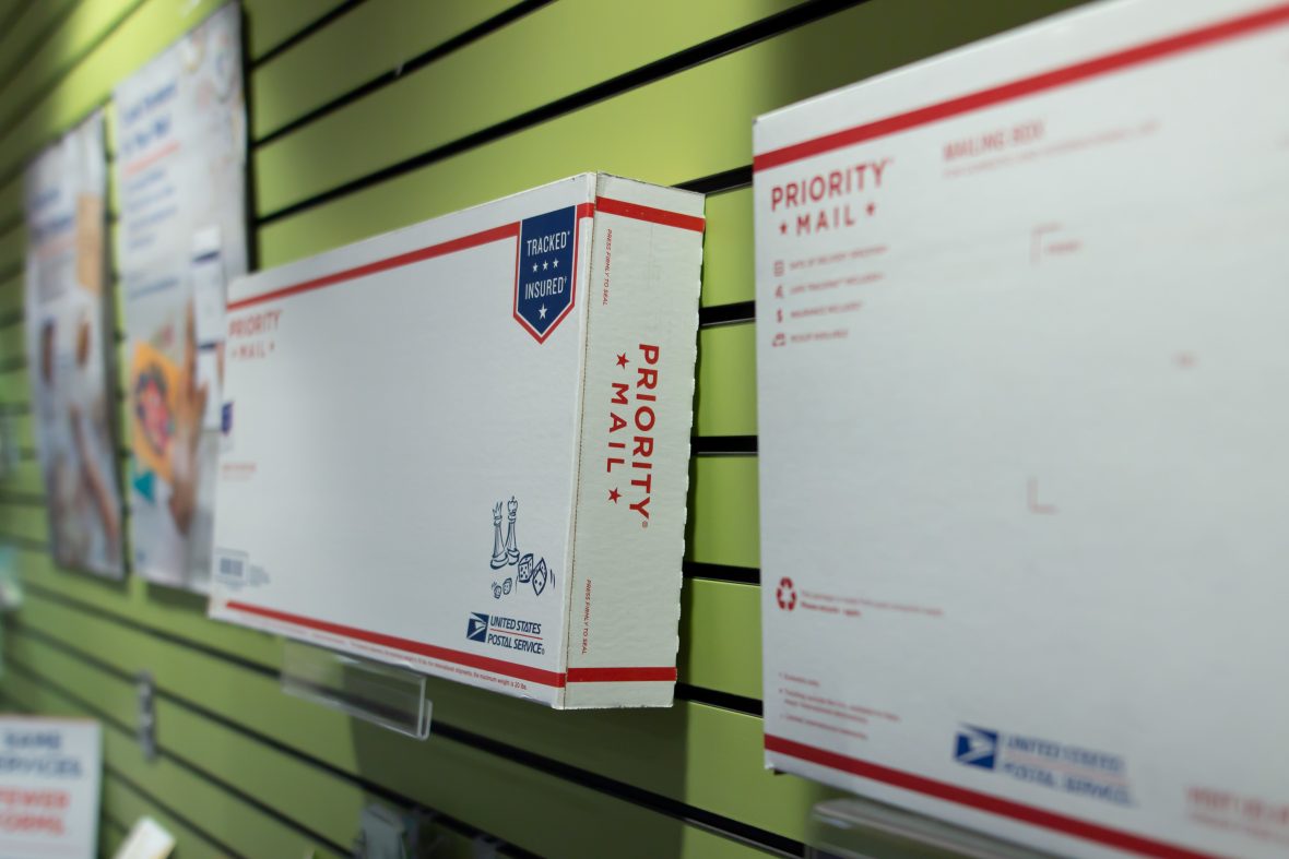 close up of different-sized package boxes on a wall.