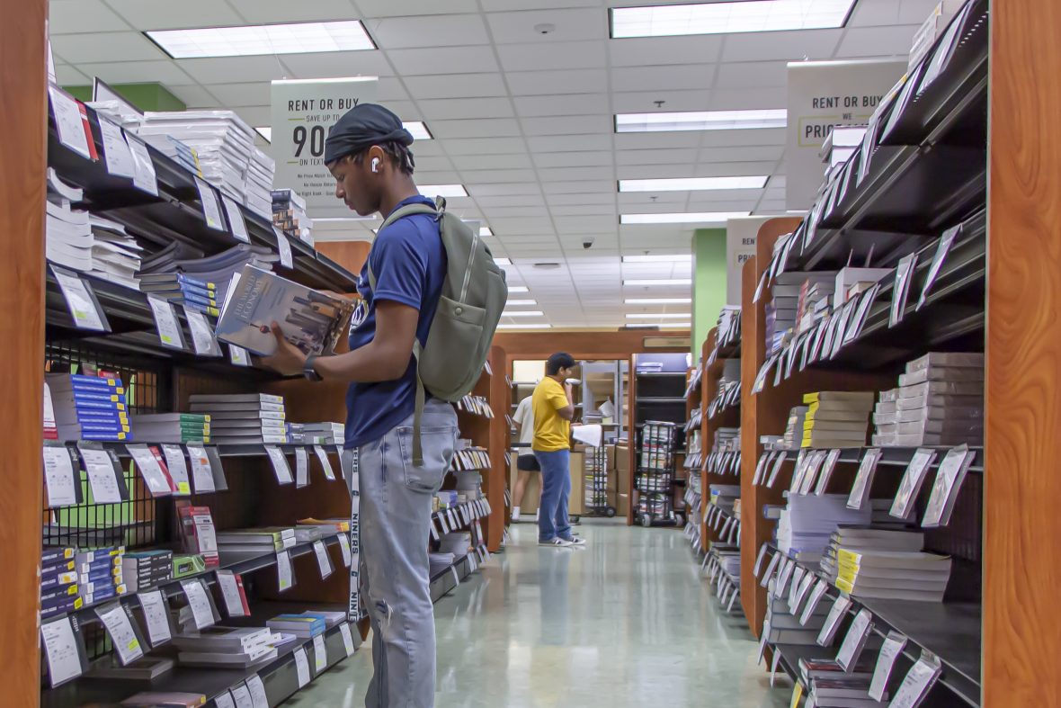 Student browsing the used books section.