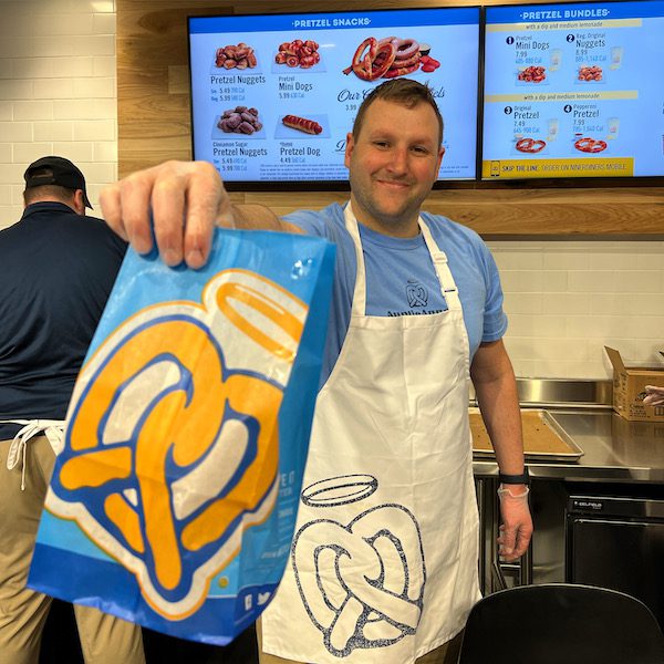 Evan Magnone sells first pretzel
