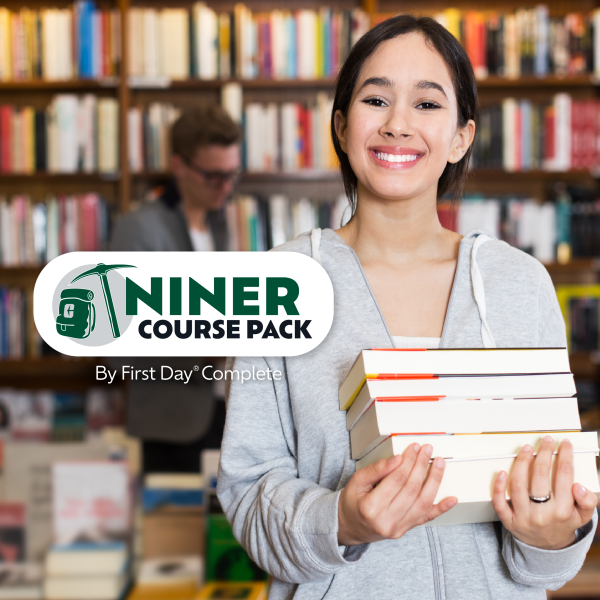 Student holding stack of textbooks smiling at camera