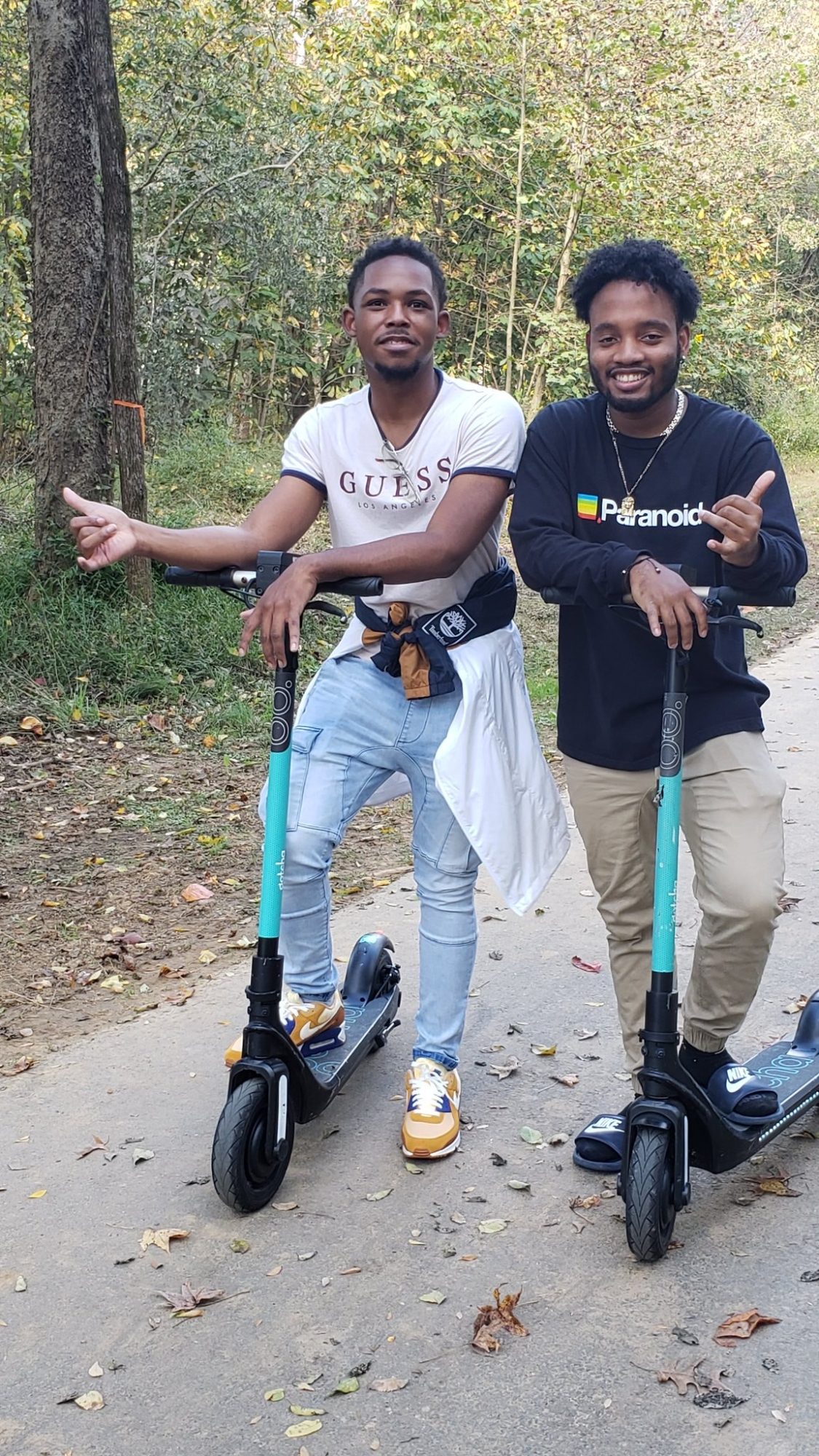 Students ride scooters on greenway