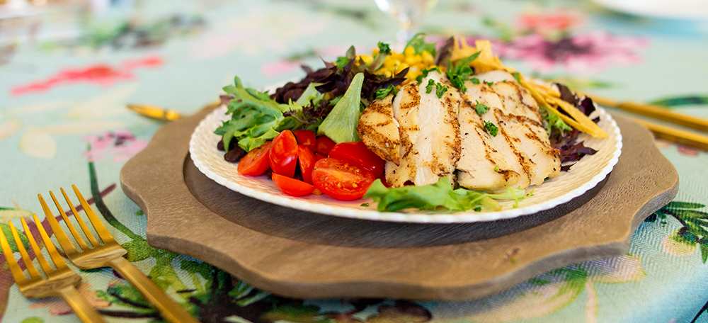 Photo of a fresh salad with grilled chicken