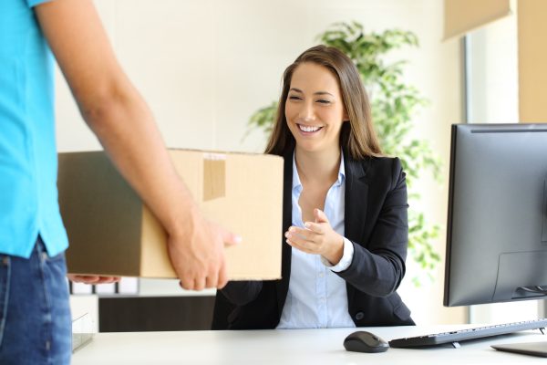 Business woman receiving a package