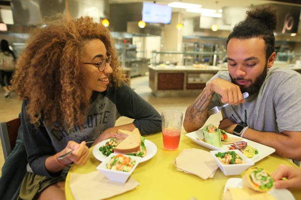 students enjoy food in the dining hall