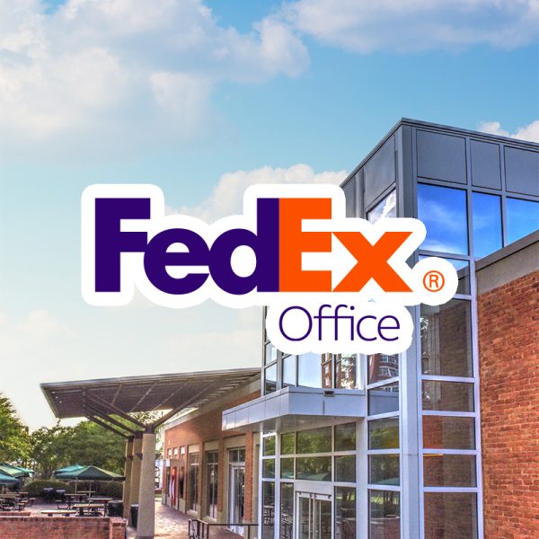 bright blue sky with Prospector building is behind the FedEx Office logo with white outline