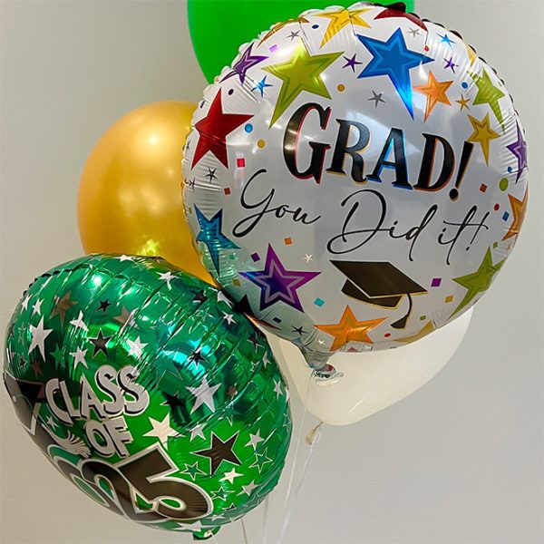 a collection of green, gold and white balloons, with one that says "Grad! You did it!" and another that says "Class of 2025"