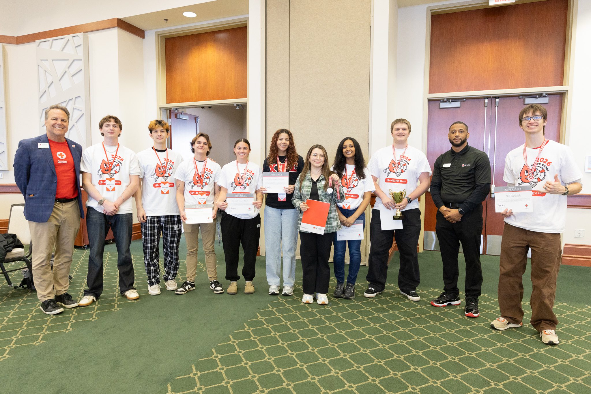 Top student recruiters for the 17th annual 49ers4Life Blood Drive pose with American Red Cross organizers.