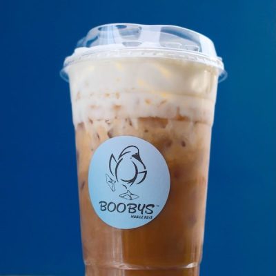 tasty looking coffe beverage in a plastic togo cup with the logo of an illustrated bird and the name Boobys Mobile Bevs
